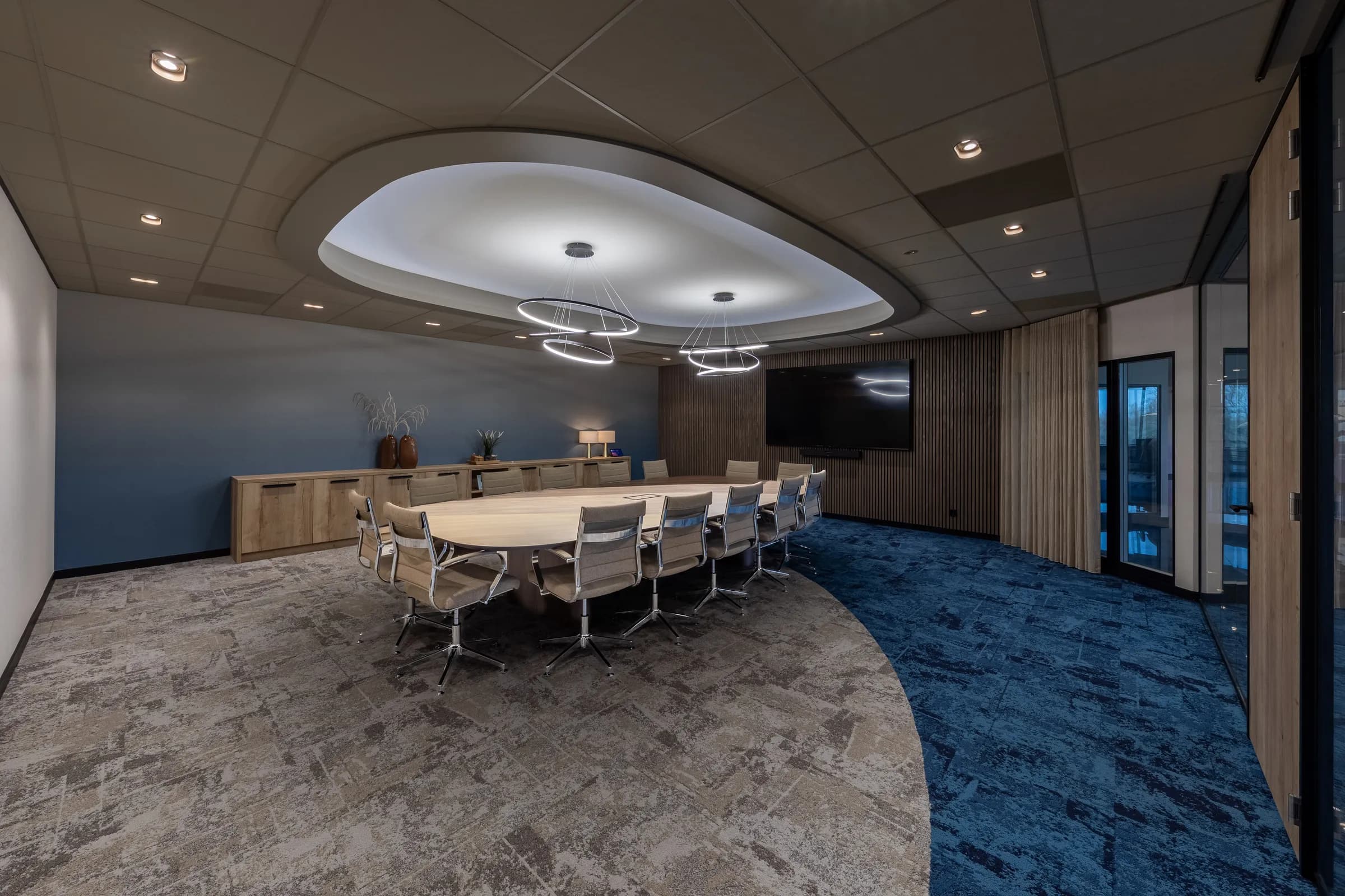 Wide view of the Kramer Seafood boardroom with the oval table on a steel spider base