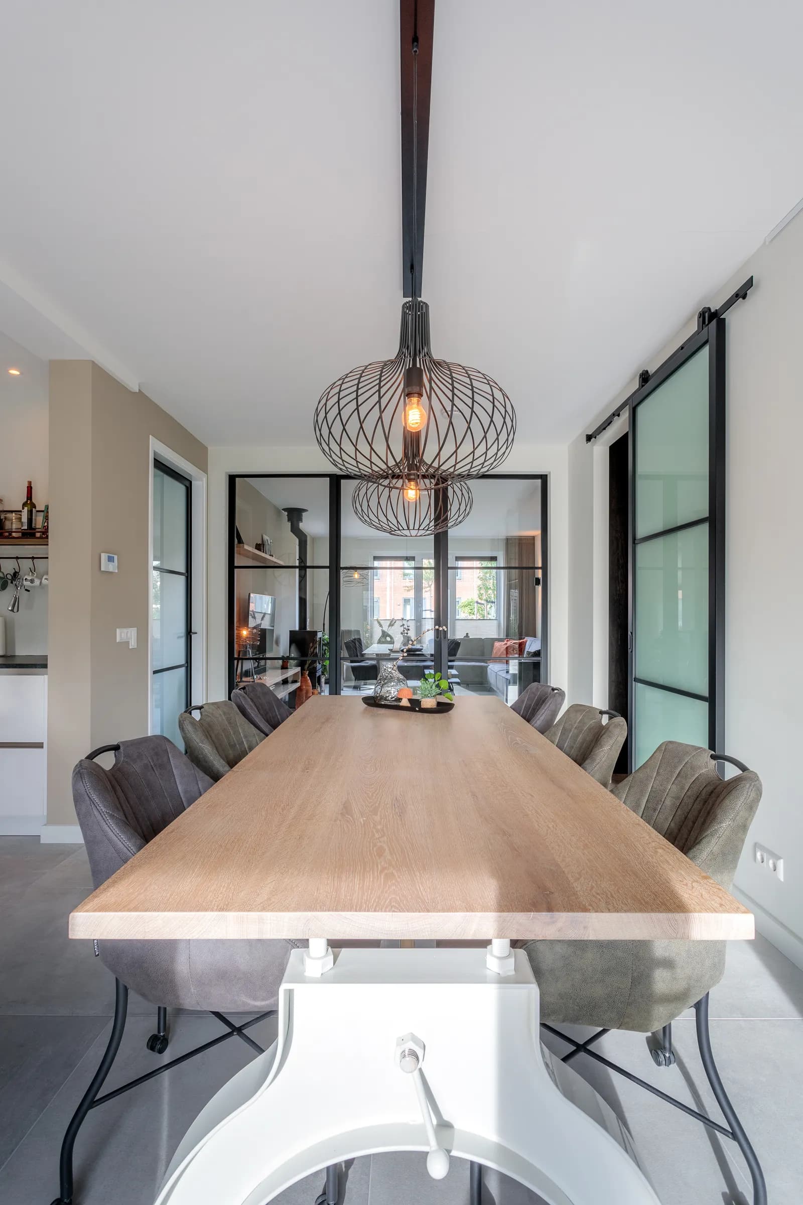 Oak dining table seen up close along its length in the Loosman family home